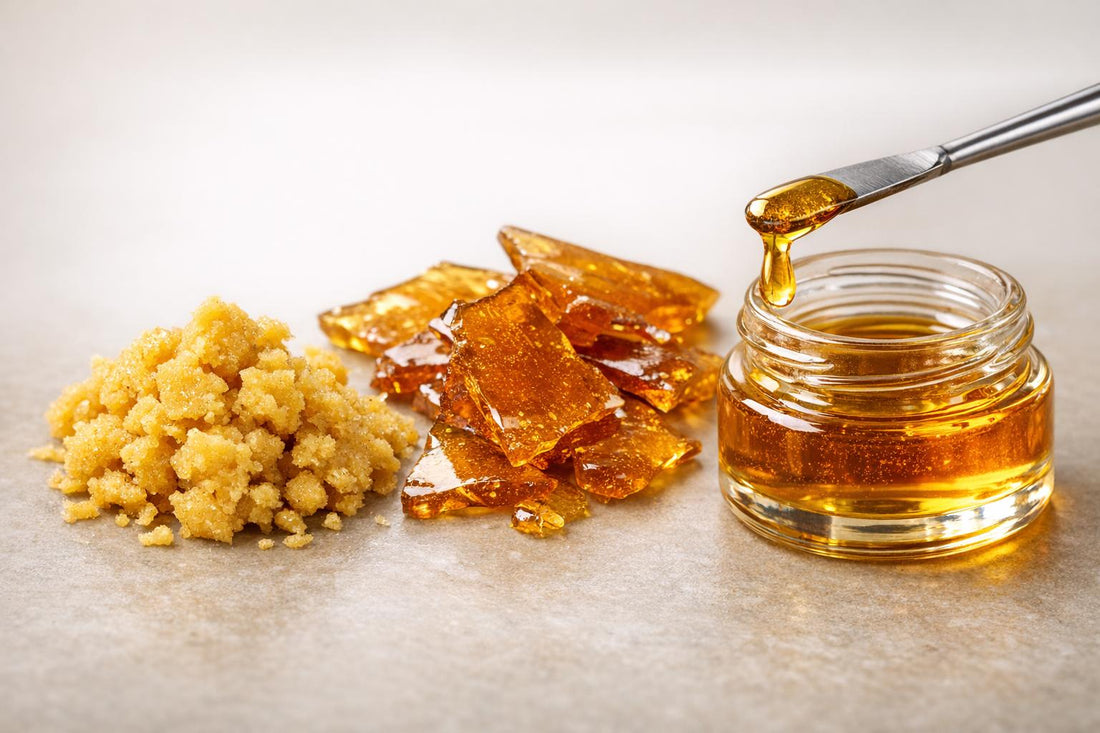 Various forms of cannabis concentrates including shatter, crumble, and honey oil in a jar.