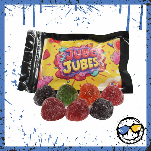 A bag of Jube Jubes candies with assorted sugar-coated gummy drops in front.